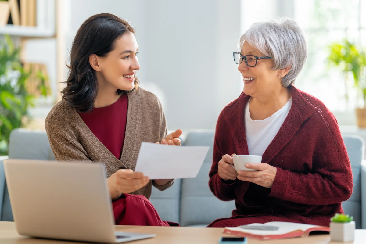Senior woman discussing finances with relative